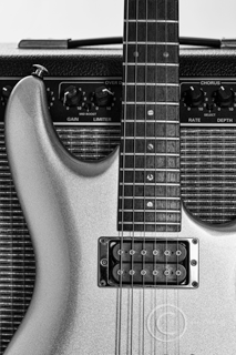 guitartherapy guitar standing up against an amplifier